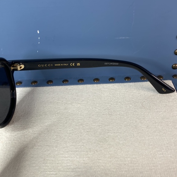 GUCCI GG0767S aviator sunglass comes in a shiny black frame with grey lenses. - Picture 10 of 14